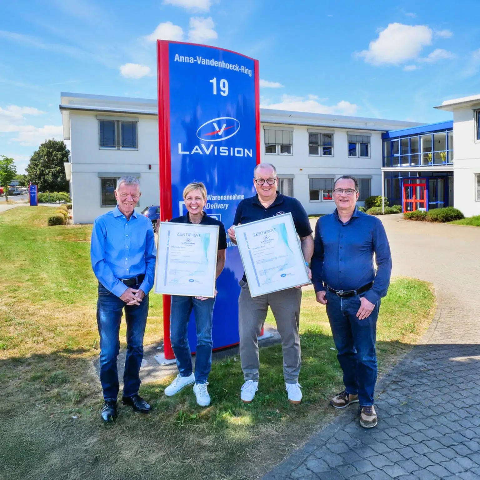 LaVision team members in front of the Göttingen headquarters celebrating ISO certification