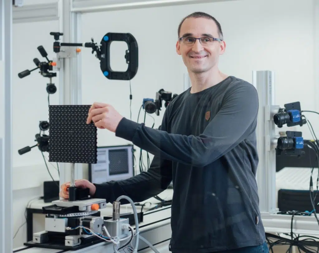 Engineer monitoring paint spray pattern analysis using LaVision optical measurement technology