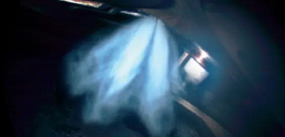Optical measurement of fuel injection spray showing spray plume and droplet distribution